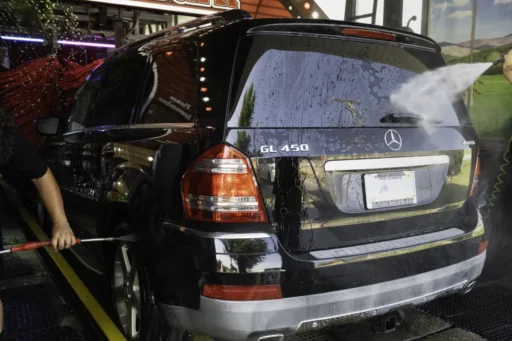 red barn car wash prewash prep pressure washing the rear bumper, back hatch, and wheels of a mercedes gl450