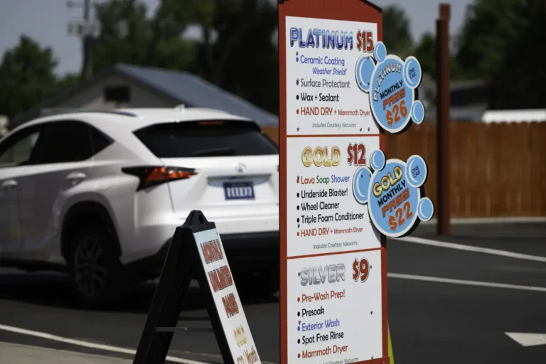 red-barn-car-wash-413-car-wash-options-pricing red barn car wash sign gardnerville car wash services, package options, and pricing with white suv in the background